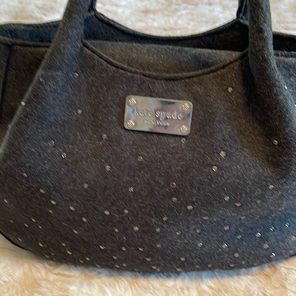 Elegant dark gray hand bag by Kate Spade.  Brand new and never used.